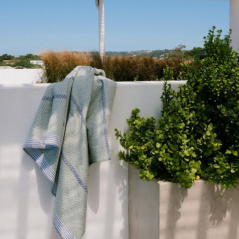 Elegant bathroom towel draped over outside wall