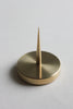 Close up of solid brass spike candle holder