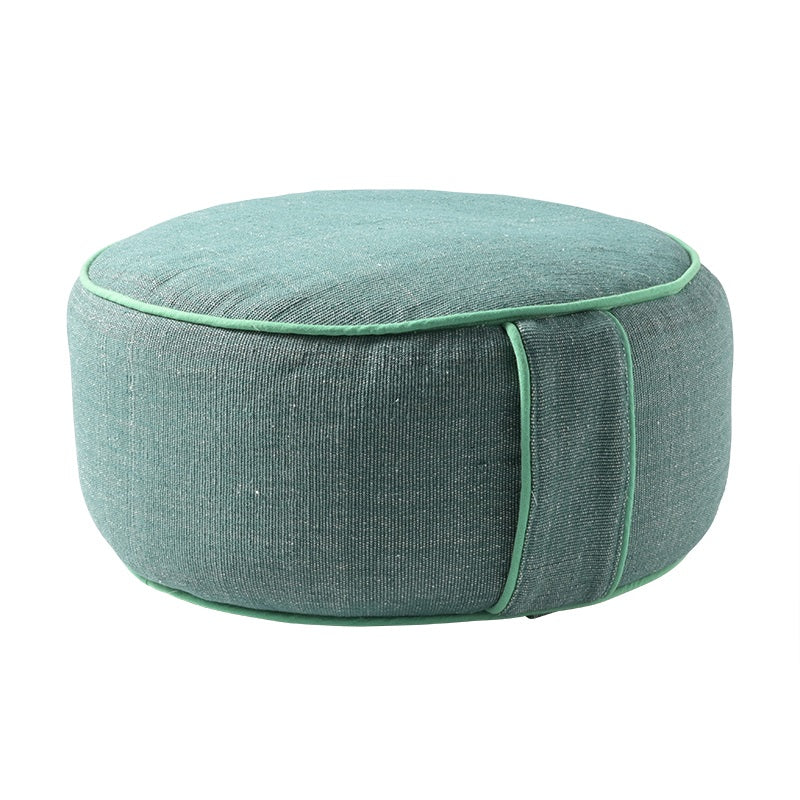 Green fabric floor cushion with a white background.