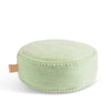 Sage green fabric floor cushion with a white background.