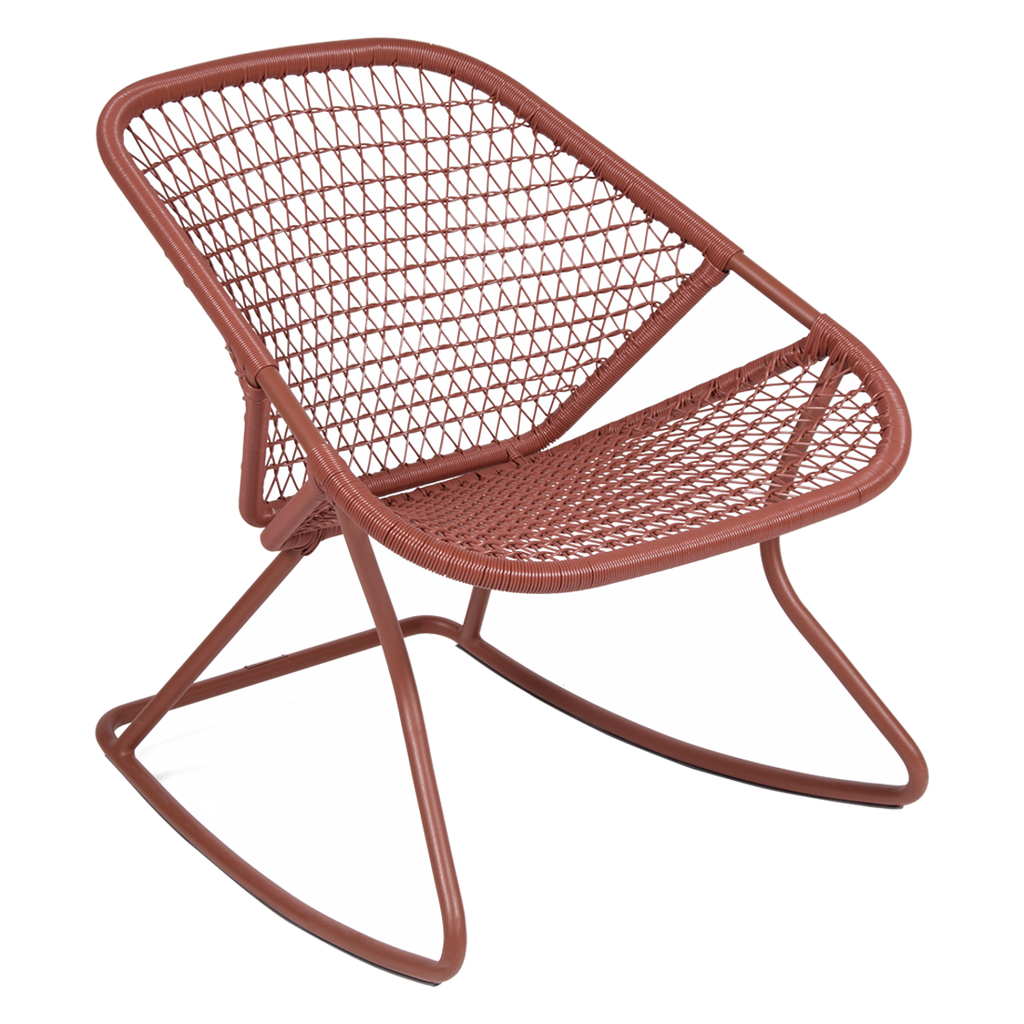 A red aluminum and fiber woven rocking chair.