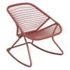 A red aluminum and fiber woven rocking chair.