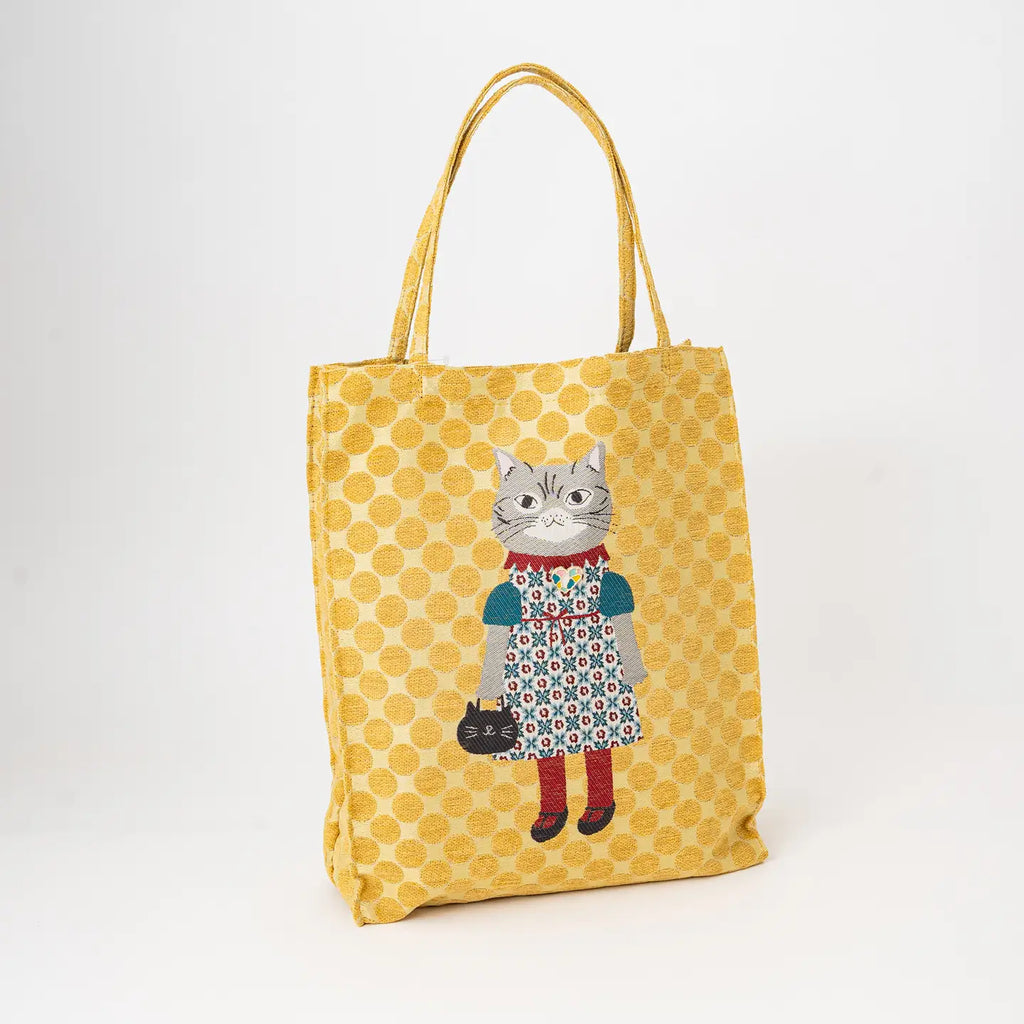 Yellow tote bag with a cat illustration on a white background