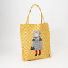 Yellow tote bag with a cat illustration on a white background