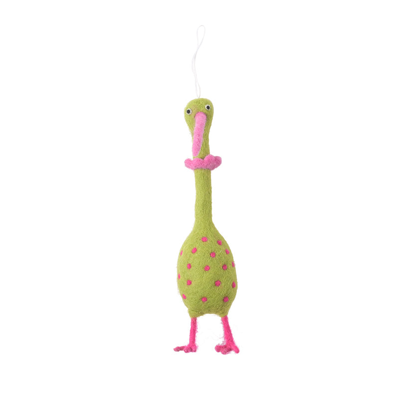 A colorful bird-shaped wool toy with a green body, pink beak and feet, and a pattern of pink spots on the body.