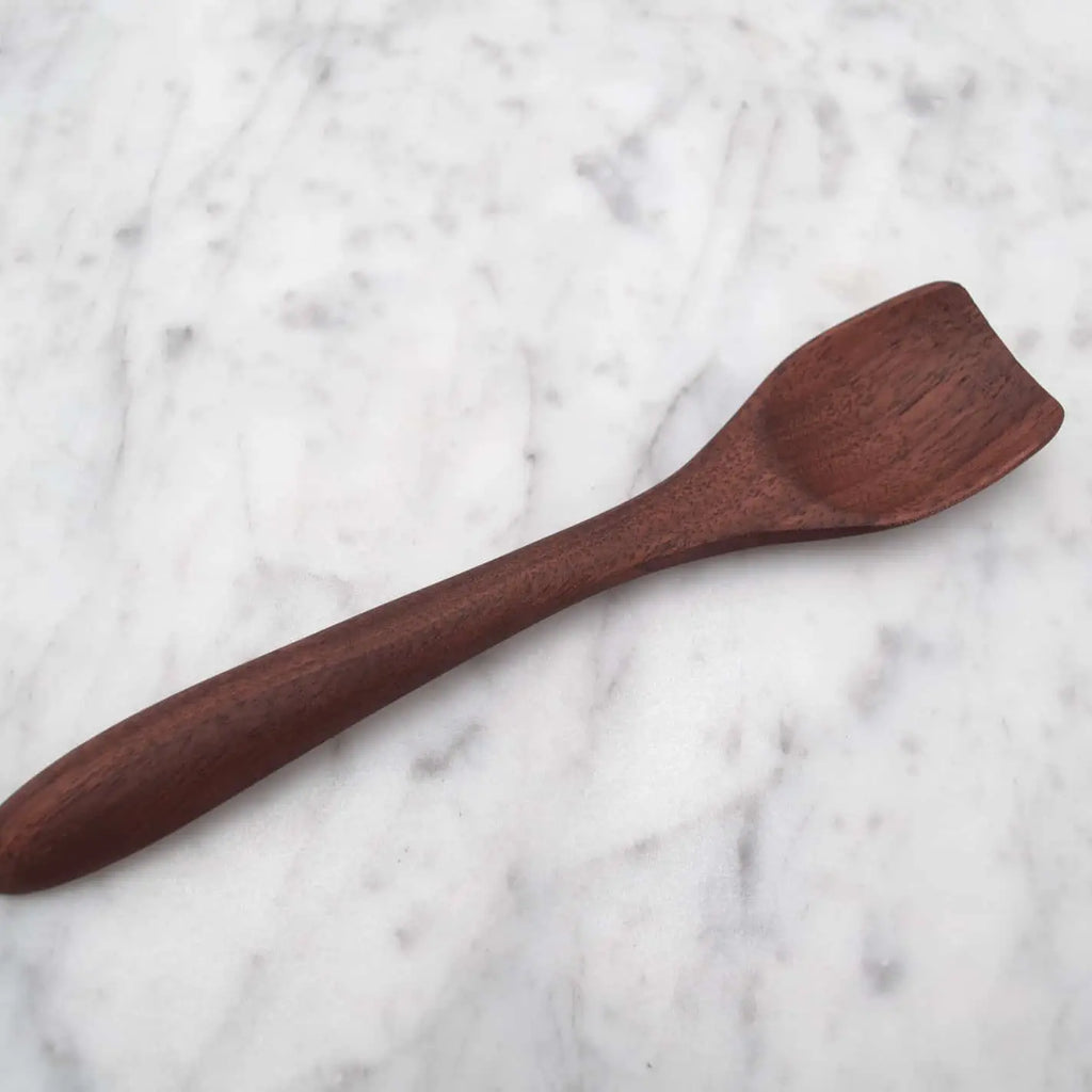 Wooden spoon on a marble surface