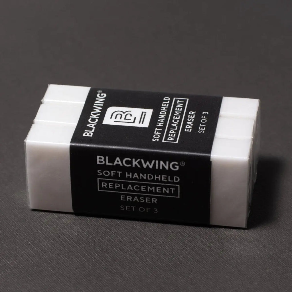 Set of three Blackwing soft handheld replacement erasers on a dark gray background