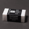 Set of three Blackwing soft handheld replacement erasers on a dark gray background