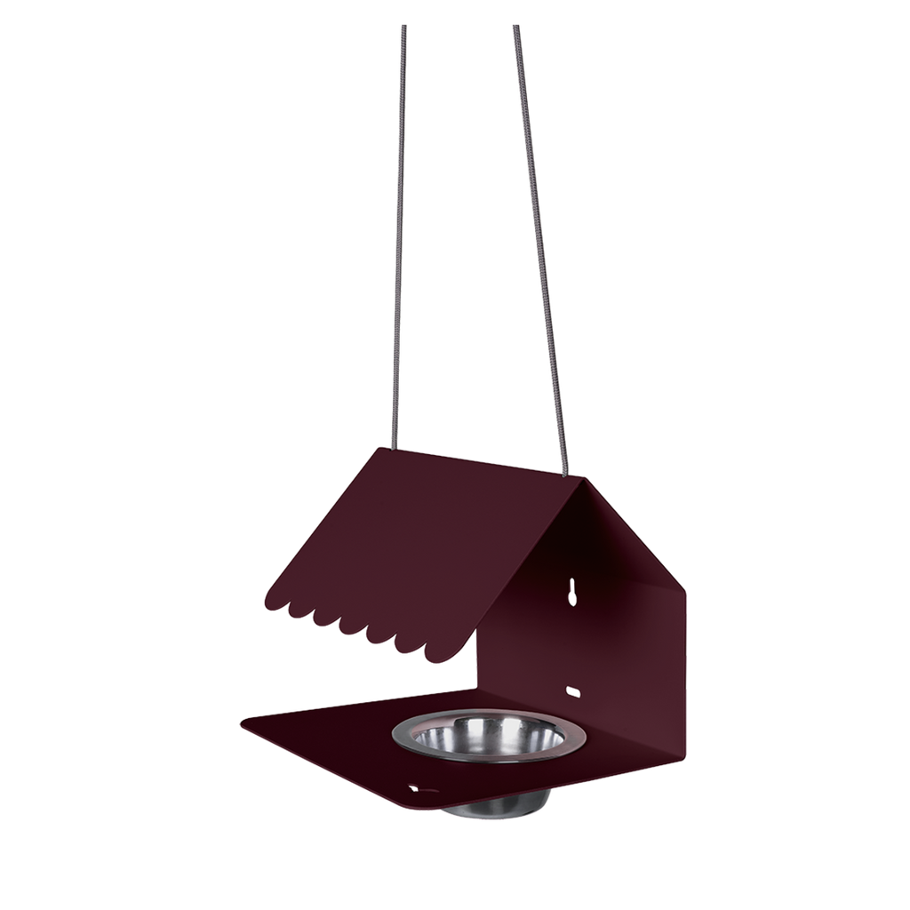A dark red Picoti bird feeder with a stainless steel bowl, hanging from a cord.