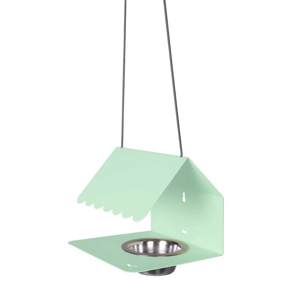 A green Picoti bird feeder with a stainless steel bowl, hanging from a cord.