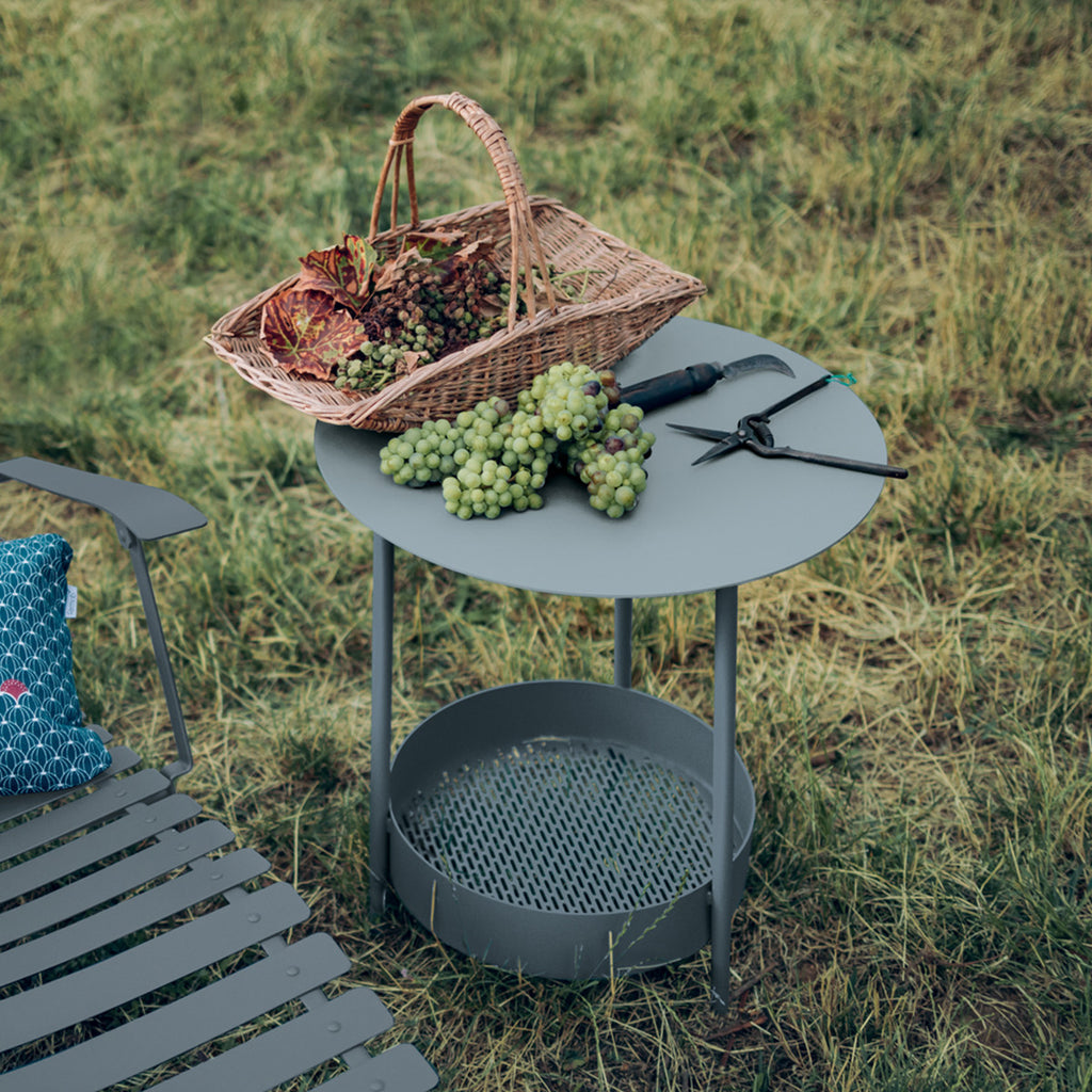 A green Salsa Side Table with a steel frame, a steel sheet table top, and a steel mesh bottom.