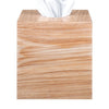Wooden tissue box cover with tissues peeking out on a white background