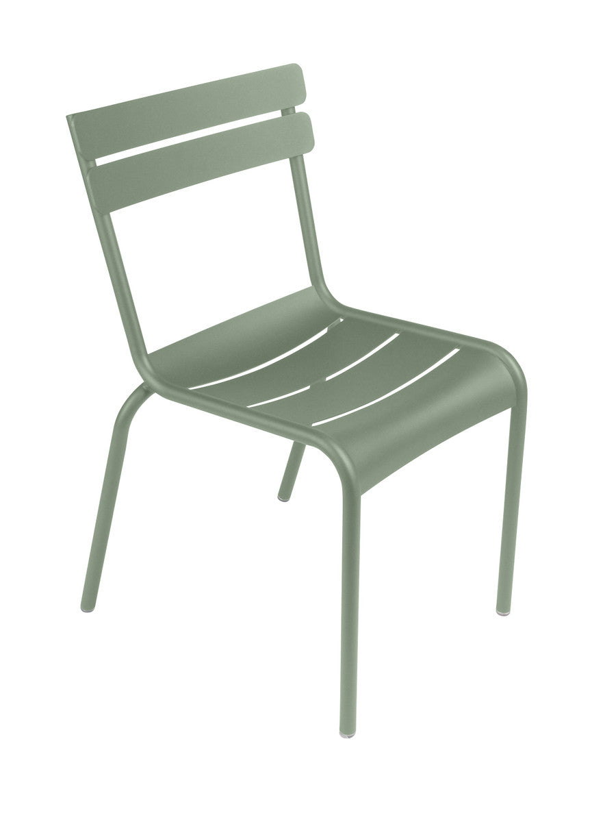 One green Luxembourg side chair with tubular aluminum frame and curved aluminum slats.