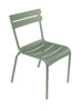 One green Luxembourg side chair with tubular aluminum frame and curved aluminum slats.