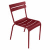 One dark red Luxembourg side chair with tubular aluminum frame and curved aluminum slats.