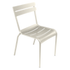 One cream Luxembourg side chair with tubular aluminum frame and curved aluminum slats.