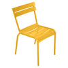 One yellow Luxembourg side chair with tubular aluminum frame and curved aluminum slats.