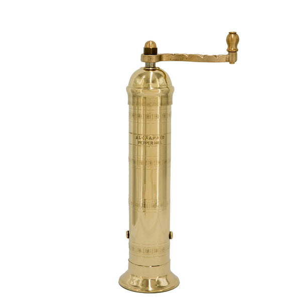 Brass pepper grinder on a white background