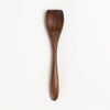 Wooden spoon on a white background
