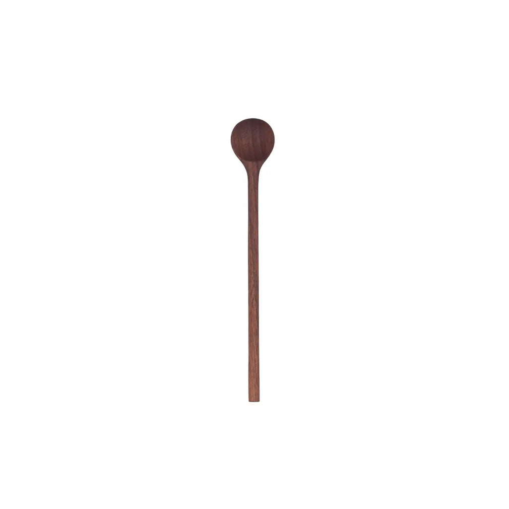 A single walnut wood stirring spoon on a white background.