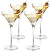 Four clear martini glasses filled with a pale yellow drink and garnished with olives on a white background.