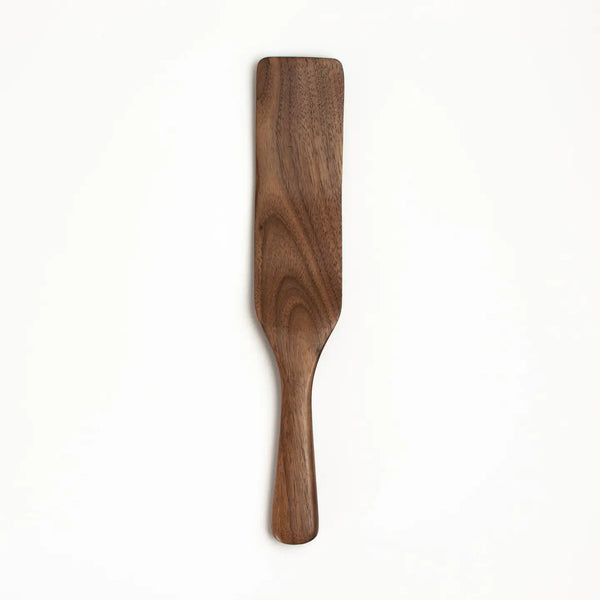Wooden spatula on a white background