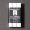 Three white handheld erasers in a black plastic sleeve labeled BLACKWING Soft Handheld Replacement Eraser Set of 3, photographed on a dark gray textured background.