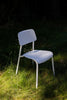 White lightweight aluminum chair with curved seat for comfort. 