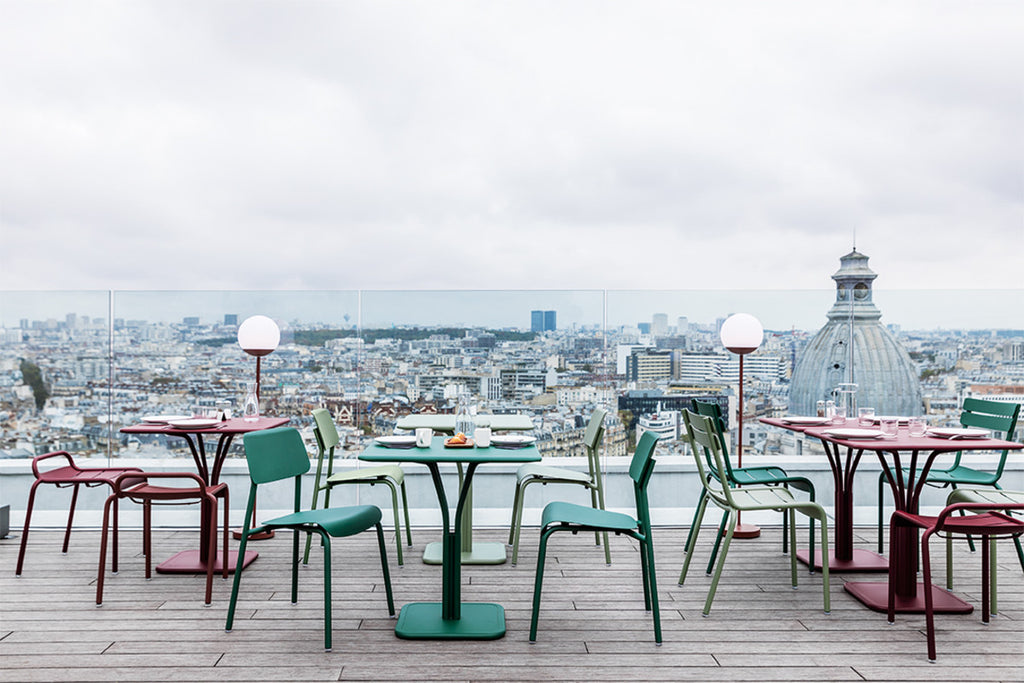 Red, green and cactus lightweight aluminum chairs with curved seat for comfort. 