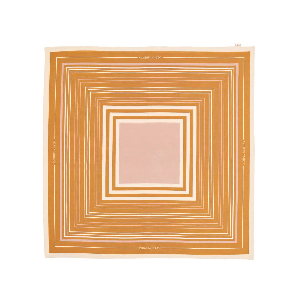 A scarf with a geometric stripe pattern in mushroom, rich tan, and clotted cream colors, displaying the Lorna Murray brand name.