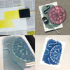 Collage of cyanotype prints on a light gray background