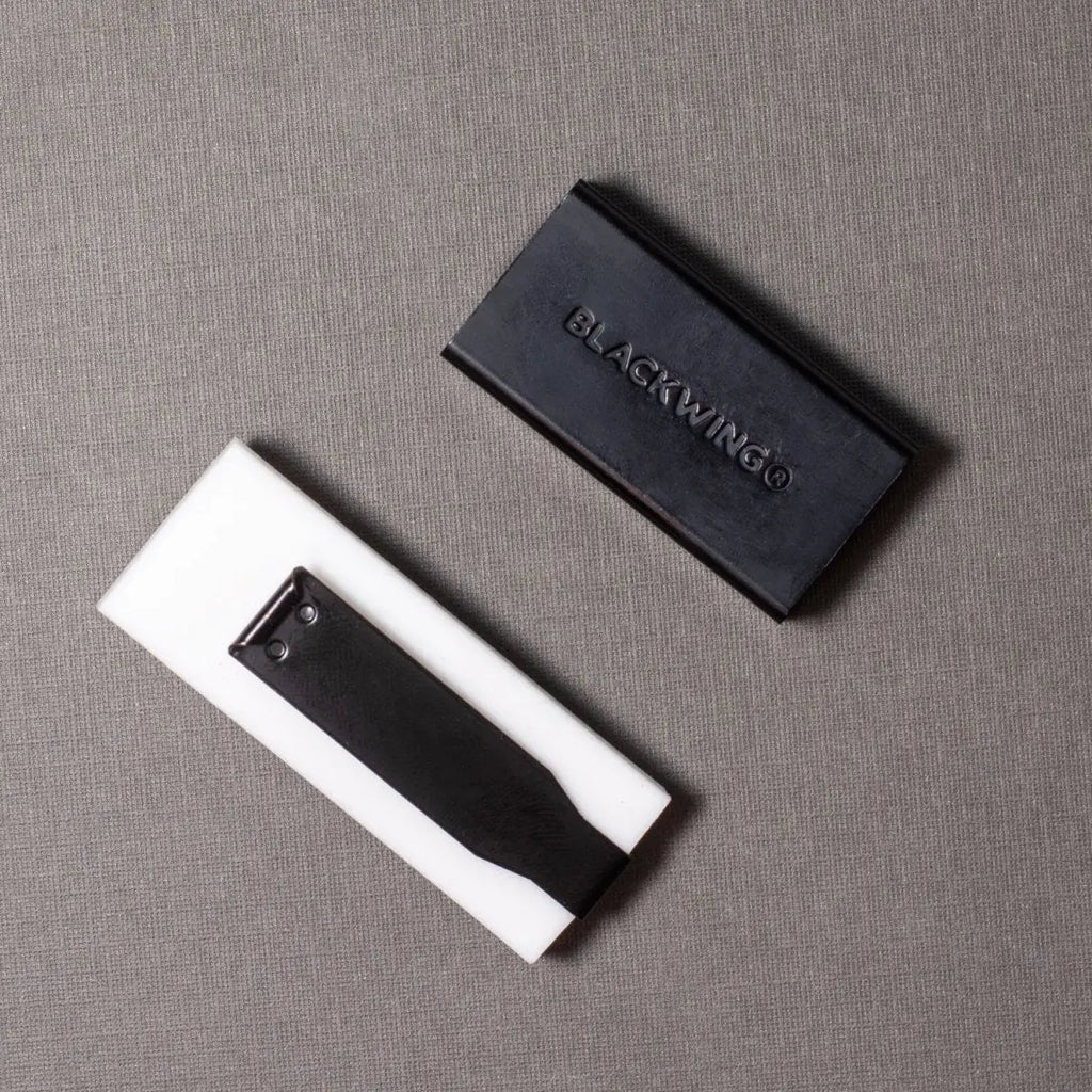 White eraser with 'BLACKWING' branding on a gray surface