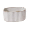 Oval ceramic planter with textured surface on a white background