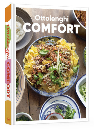 Cookbook titled 'Ottolenghi Comfort' with a photograph of a dish on the cover.