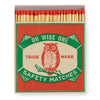 A decorative matchbox with an owl