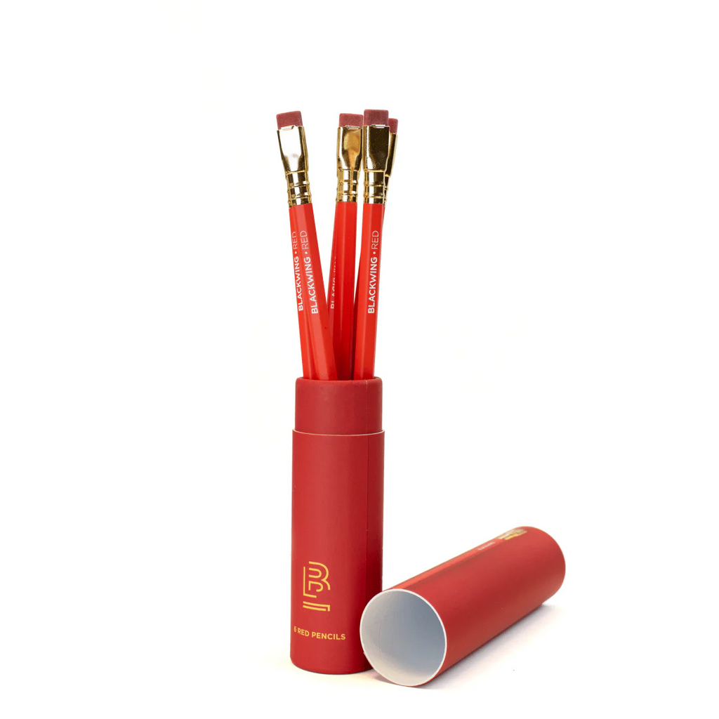 Red pencil set with gold accents in a matching red case on a white background