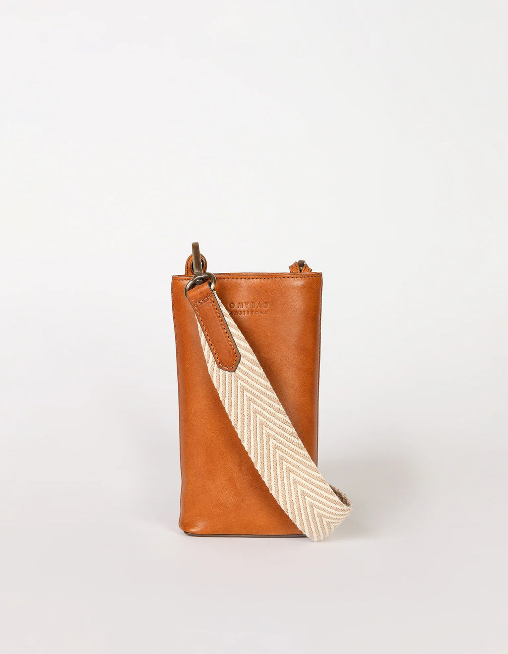 A brown Charlie Phone Bag with a striped cotton lining, featuring a main compartment, three card slots, and two straps including a tan one and a beige one with a geometric pattern.