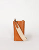A brown Charlie Phone Bag with a striped cotton lining, featuring a main compartment, three card slots, and two straps including a tan one and a beige one with a geometric pattern.