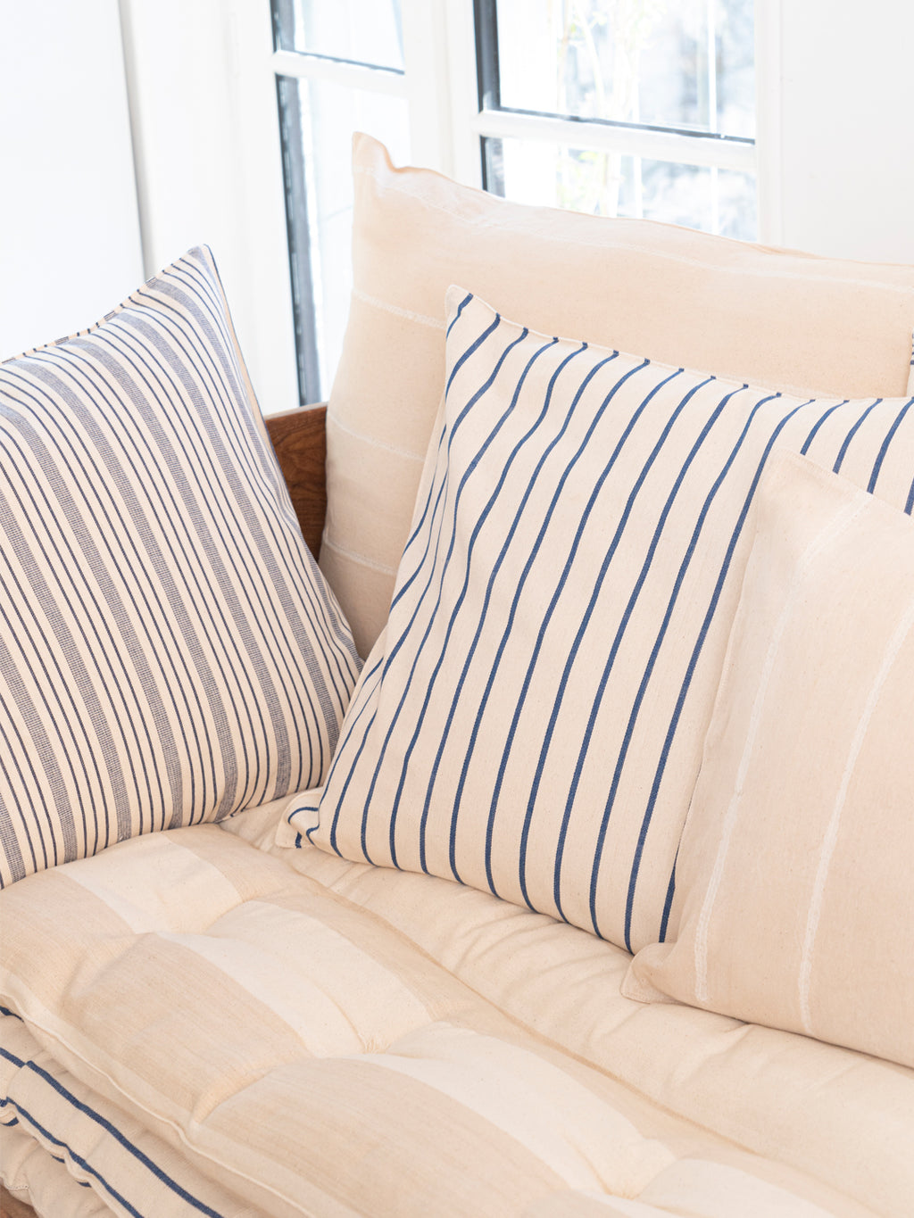 Collection of striped pillows.