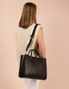 Model sporting Black Leather Jackie Bag