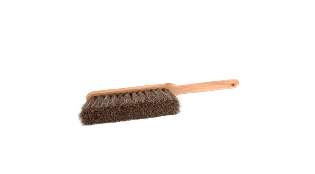 Wooden brush with bristle head on a white background