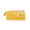 Stack of yellow towels on a white background
