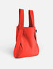 Red backpack on a light gray background