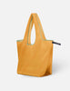 Yellow tote bag with green trim on a white background