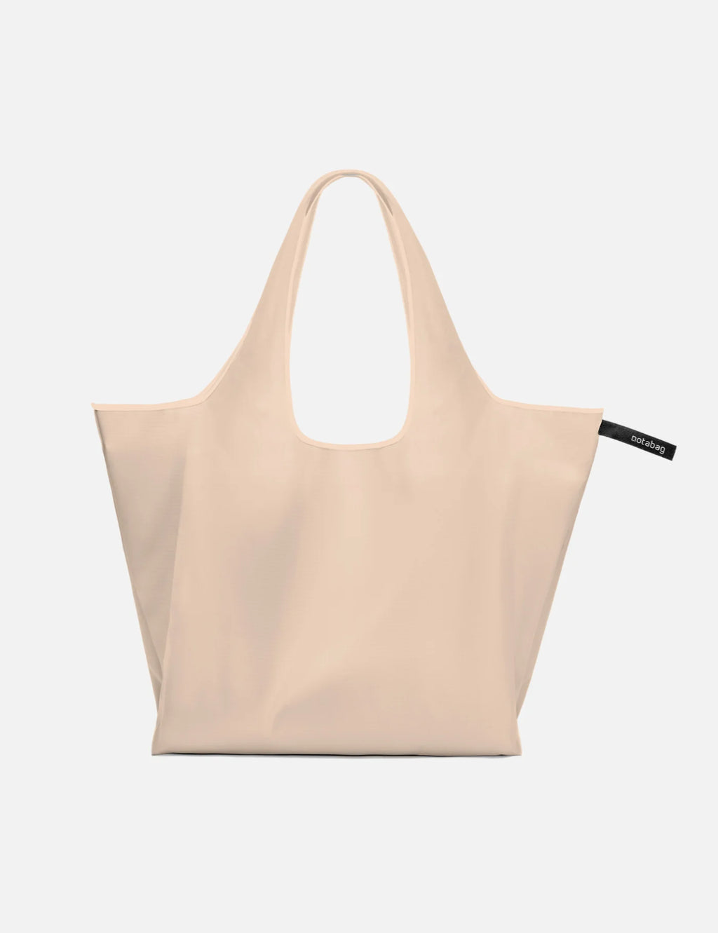 Beige tote bag with a visible brand label on a white background