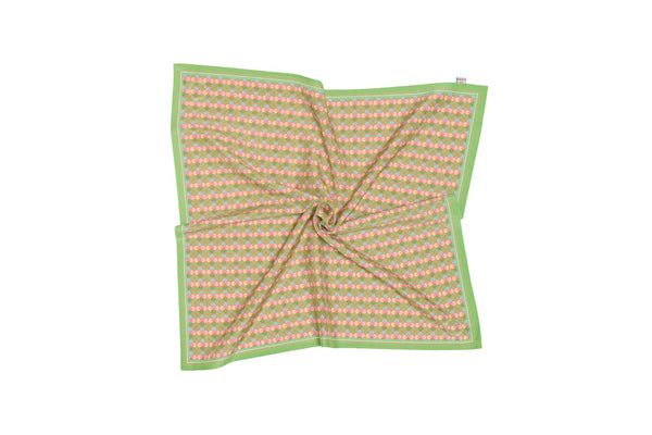 Folded fabric with pink pattern on a white background