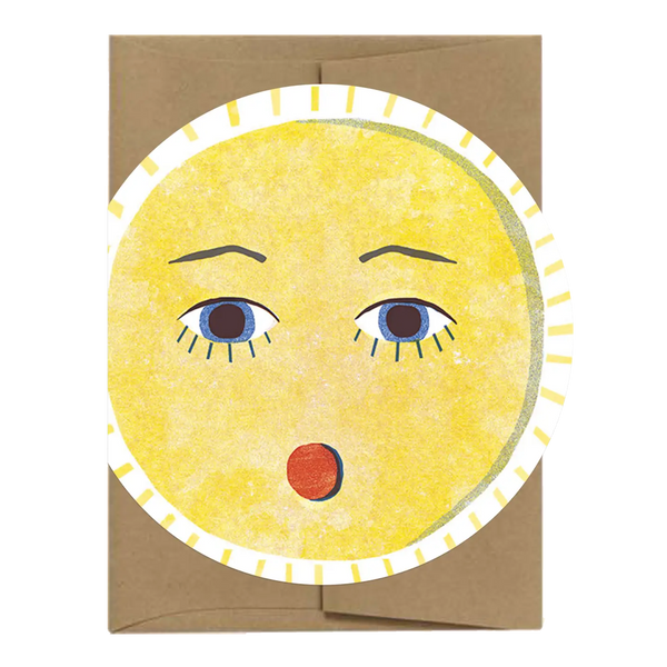 Card with a sun face design on a brown envelope