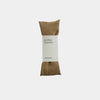 Sepia colored eye pillow with a label on a white background