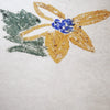 A close-up of a textured paper surface with a hand-drawn or crayon-painted flower motif, featuring mustard yellow petals, a blue center, and a green leaf on the left.