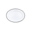 Oval white plate with black rim on a white background